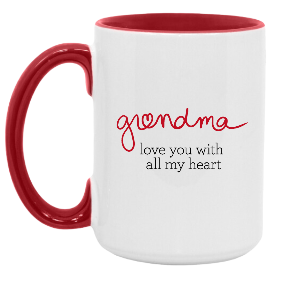 White mug with inside red finish and red handle. Side 1 "grandma" in handwriting like font with "love you with all my heart" text below. Side 2 Red dress symbol inside a heart shape.