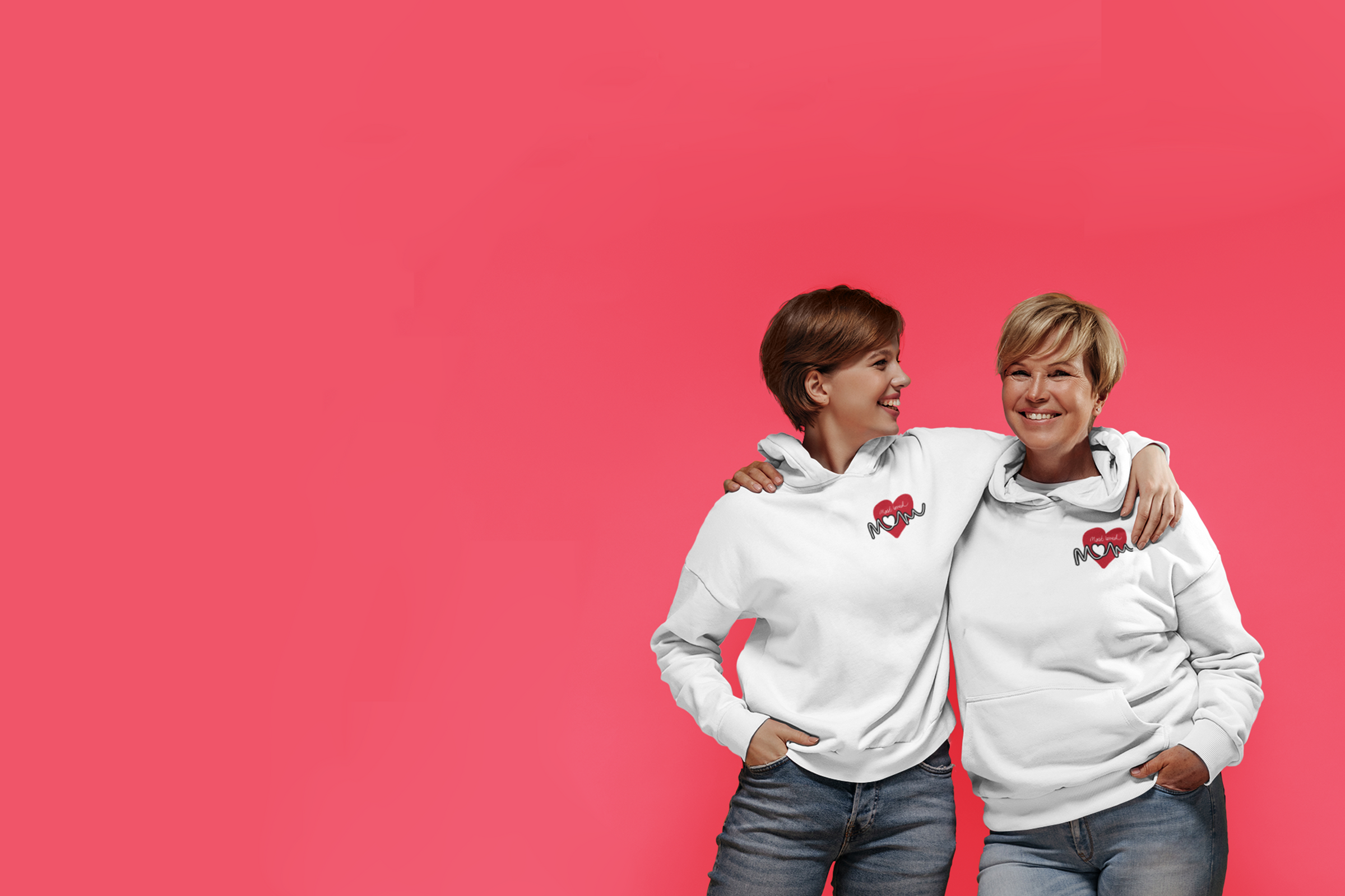 image of mom and daughter wearing matching white hoodies that say "Most Loved Mom" on a red heart on the chest.