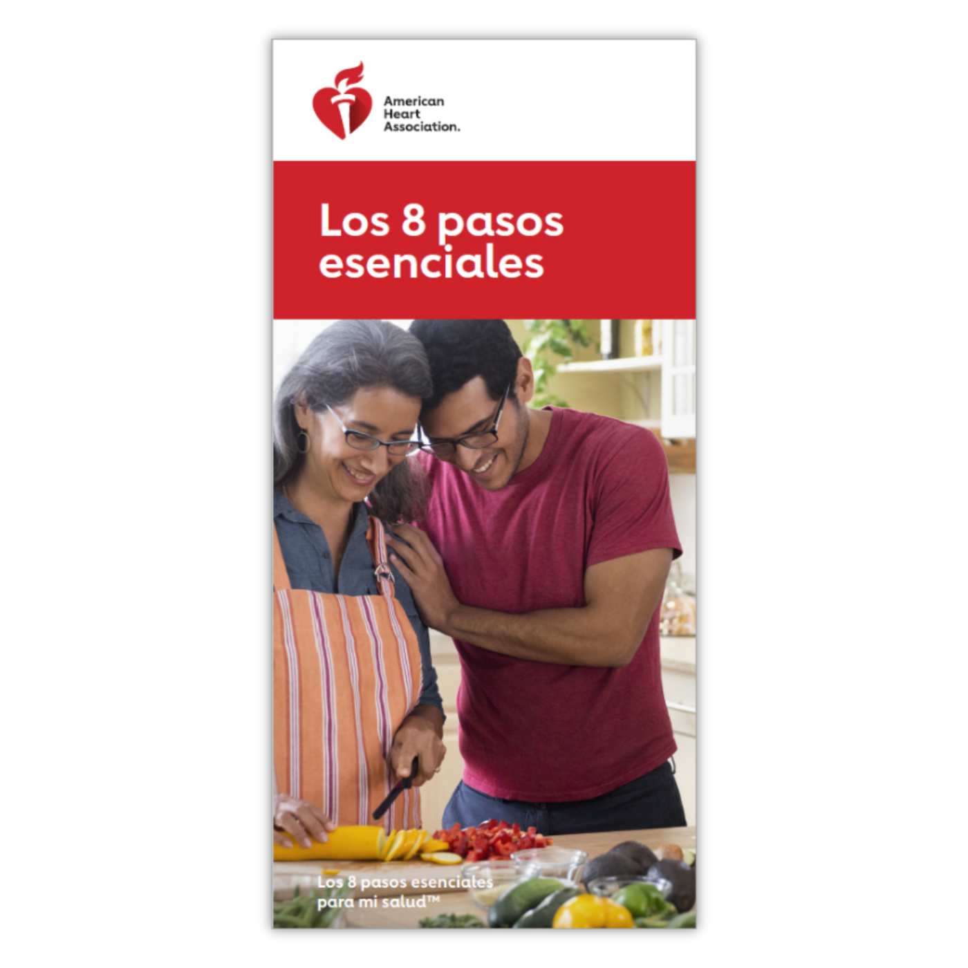 A man and women smiling together while cutting up vegetables. 