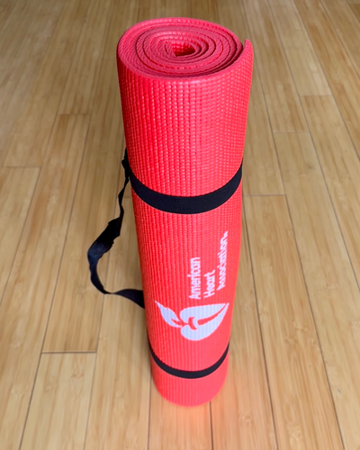 Picture showing yoga mat standing up rolled up.